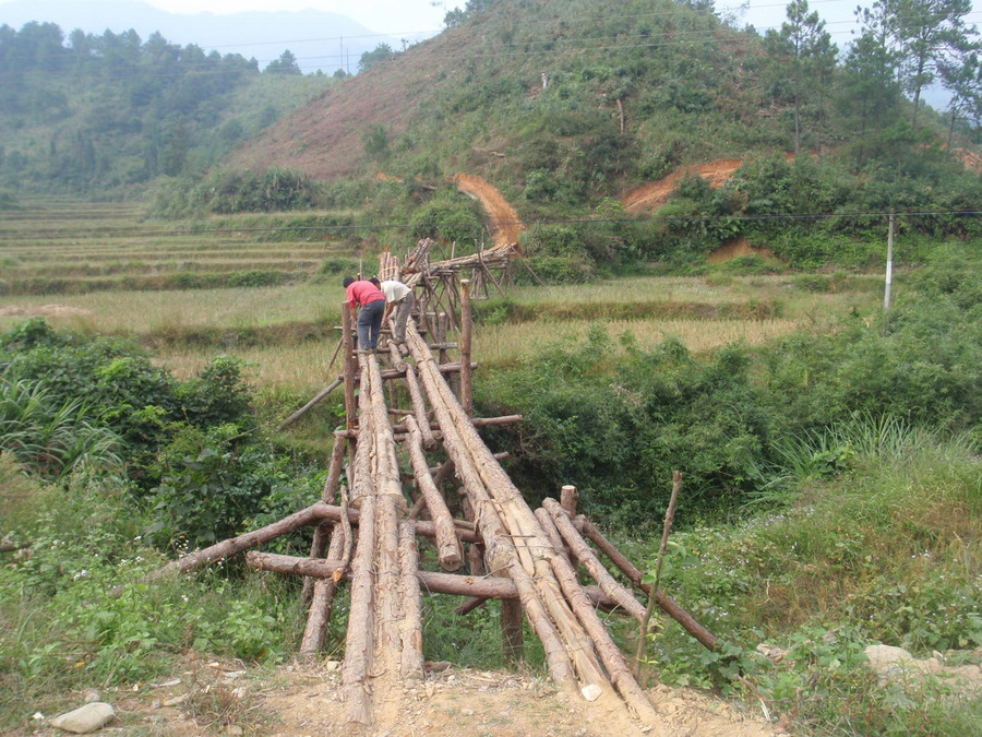 Building a wood bridge for fixed width cart wheels.